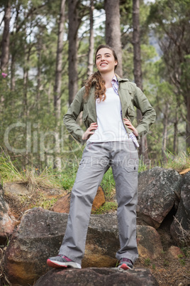 Woman standing with hands on hips