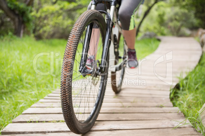 Close-up of woman cycling