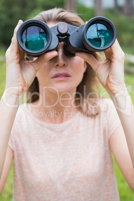 Woman using binoculars