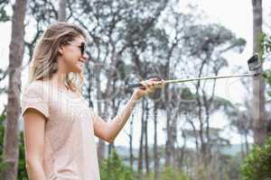 Smiling woman taking selfies