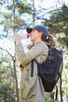 Woman drinking water while doing a break