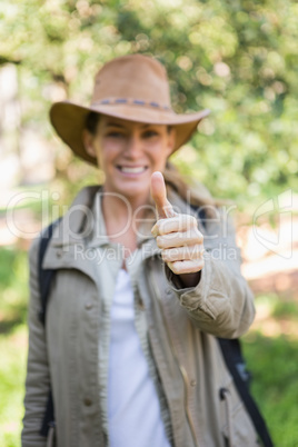 Smiling woman with thumbs up