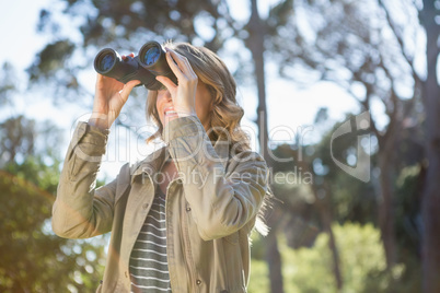 Woman using binoculars