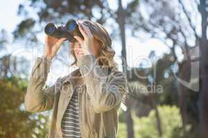 Woman using binoculars