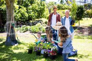 Multi-generation family gardening in the park