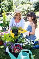 Grandmother and granddaughter gardening in the park