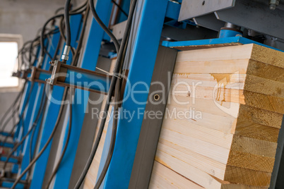 Image of glued wooden lamellas are pressed
