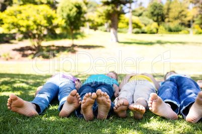 Children lying on grass