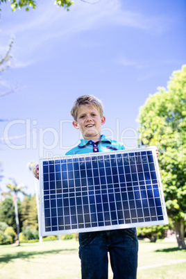 Boy holding a solar panel