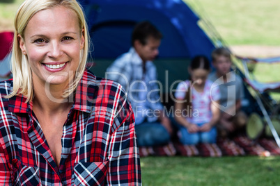 Portrait of a happy woman outside the tent