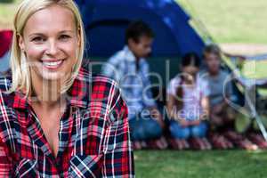 Portrait of a happy woman outside the tent