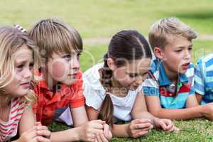 Children lying on grass