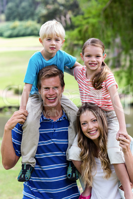 Portrait of happy family enjoying in the park