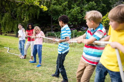 Children pulling a rope in tug of war