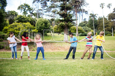 Children pulling a rope in tug of war