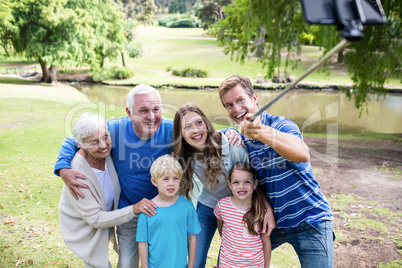 Multi-generation family taking a selfie with selfie stick