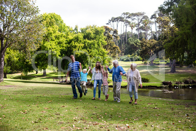 Multi-generation family walking in the park