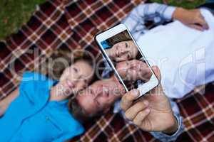 Couple taking a selfie from mobile phone