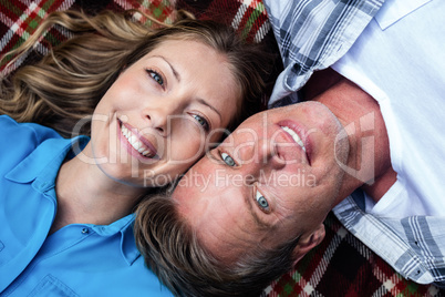 Portrait of couple lying in park