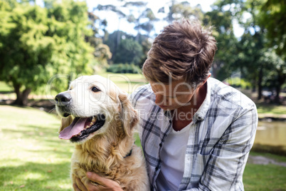 A Man is with his pet dog