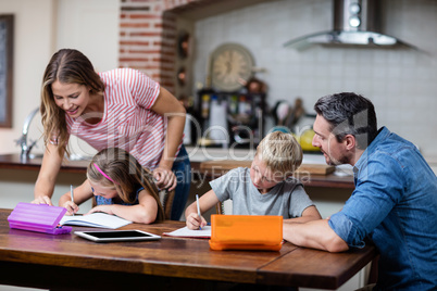 Parents helping the kids with their homework