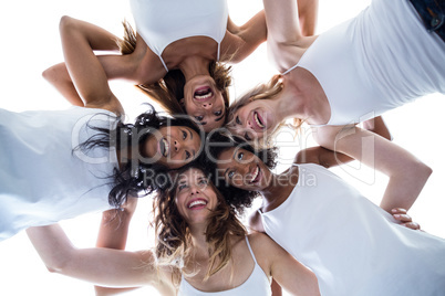 Happy women forming a huddle