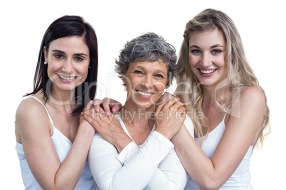 Women standing and holding hands on white background