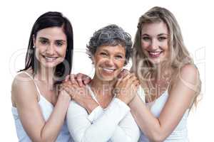 Women standing and holding hands on white background
