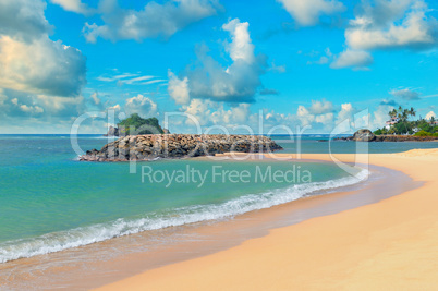 ocean, sandy beach and blue sky