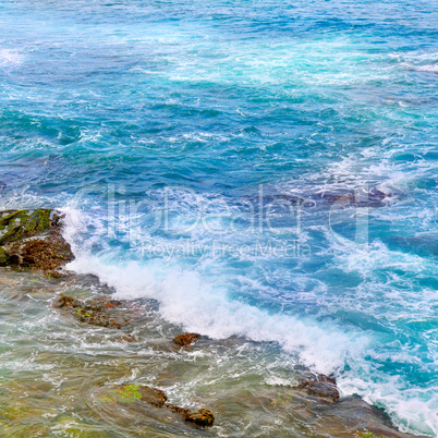 background of ocean waters and coastal stones