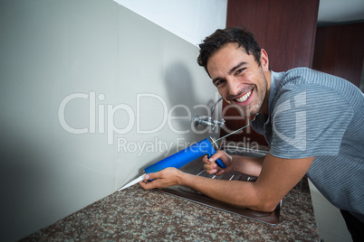 Portrait of happy man using pest control injection