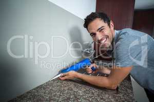 Portrait of happy man using pest control injection
