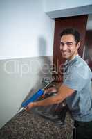 Portrait of happy man with pest control injection