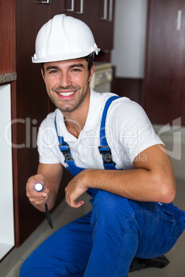 Happy man holding illuminated torch