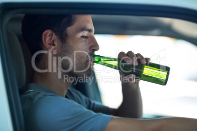 Close-up of man drinking alcohol