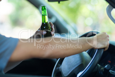 Cropped hands of man with alcohol