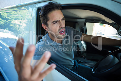 An Angry man is gesturing with his hand