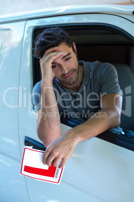 Depressed man with head in hand