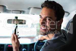 Handsome driver using phone