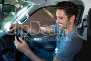 Driver using phone while sitting in car