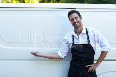 Portrait of confident delivery man with blank space