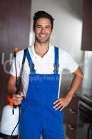 Portrait of happy confident pesticide worker