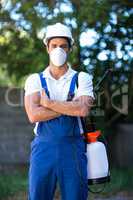 Portrait of confident pesticide worker with crossed arms
