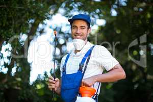 Portrait of happy insecticide worker