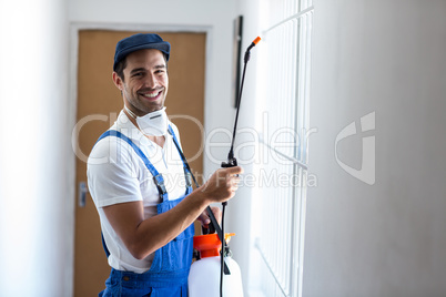 Portrait of happy pesticide worker