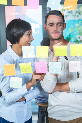 Colleagues looking at sticky notes