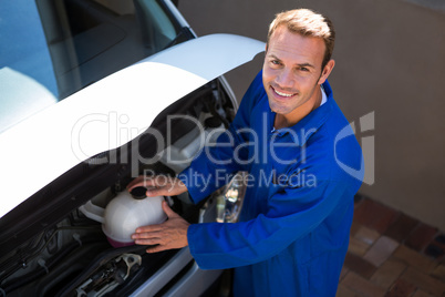 Mechanic examining the car