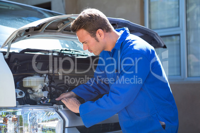 Mechanic examining the car