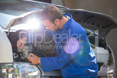 Mechanic examining the car