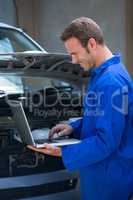 Mechanic using a laptop